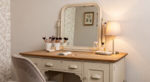 Repurposed vintage desk styled as a vanity
