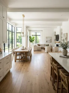 Alt Text: Open kitchen with continuous flooring connecting living spaces.