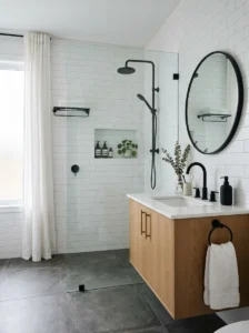 White bathroom with bold black fixtures.