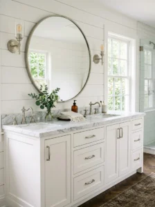 White shaker bathroom vanity with marble countertop.