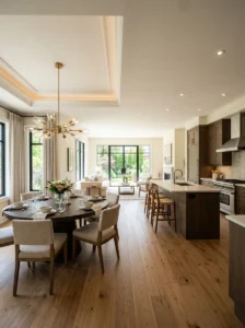 Open concept home using a tray ceiling to define the dining area.