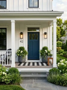 Bold navy front door creating a welcoming entrance.