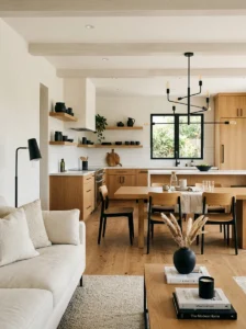 Open concept home using repeated black metal accents and warm wood throughout.