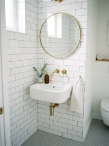 Corner sink maximizing floor space in a small bathroom.