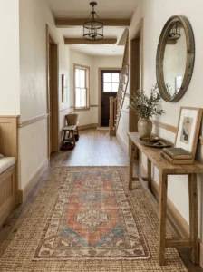 Vintage-style layered rug adding character to an entryway