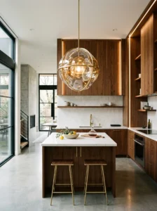 Large statement pendant centered above a small kitchen island.