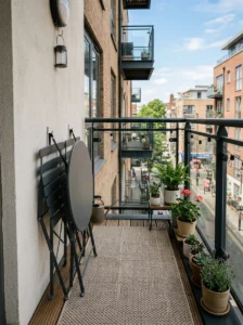 Foldable balcony furniture creating flexible open floor space.