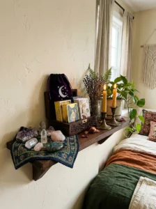 Tarot card display and storage in a witchy bedroom.