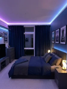 Deep navy curtains coordinating with bedding in an anime bedroom.
