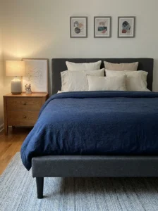Sophisticated anime bedroom with subtle navy themed bedding.