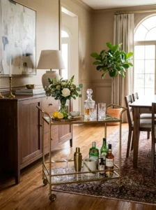 ramatic brass and glass chandelier above an elegant dining table.