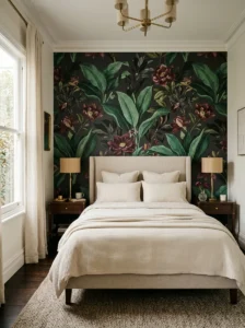 Bold emerald and burgundy botanical wallpaper in a bedroom