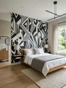 Black and white geometric wallpaper accent wall in a modern bedroom