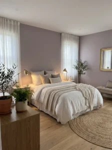 usty lavender bedroom walls with white bedding and gold accents
