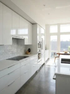 Ombre kitchen cabinets transitioning from sage green to forest green