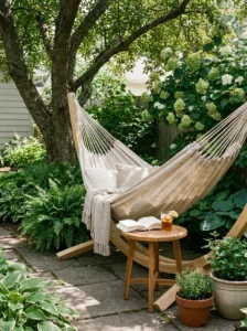 Teak outdoor dining set with umbrella on a backyard patio