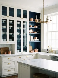 : White kitchen cabinets with contrasting navy blue interiors