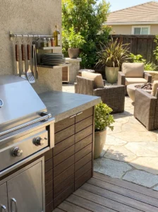 Compact outdoor kitchen with grill, storage and prep counter