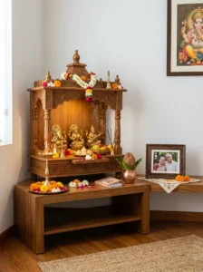 Respectfully displayed family photo beside a traditional mandir